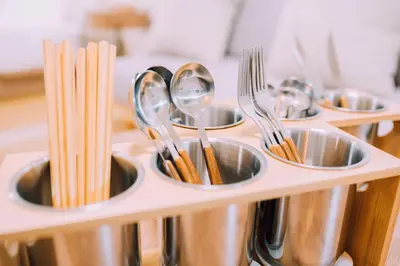 a row of stainless steel spoons and forks at Showa Bloom Near Shinjuku Station in Tokyo