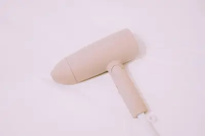 a white hair dryer on a white background at Showa Bloom Near Shinjuku Station in Tokyo