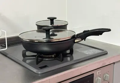 a pot sitting on top of a stove at Shinkoiwa HOUSE in Tokyo