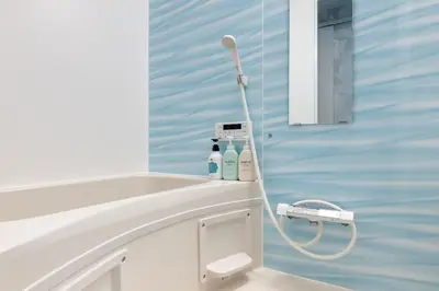 a bathroom with two bottles of soap on a counter at Shinkoiwa HOUSE in Tokyo