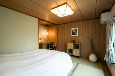 a bedroom with a bed and a desk at Shinjuku Zen House 2F 70sqm Traditional Reno Premium Bed R2 in Tokyo