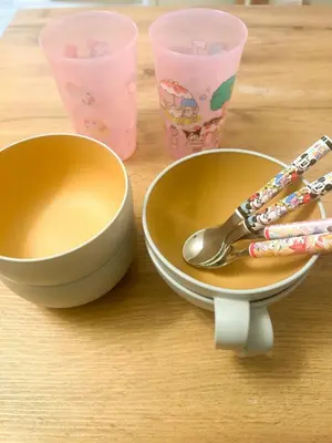 two bowls and a spoon on a table with cups at Family Friendly Japanese Style Room near Skytree in Tokyo