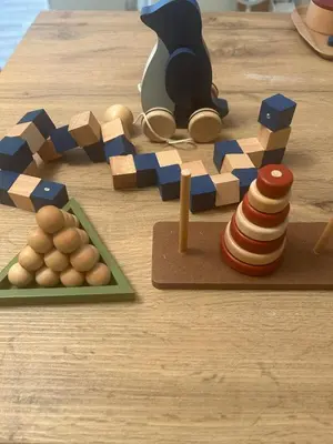 a table with a wooden puzzle and a toy train at Family Friendly Japanese Style Room near Skytree in Tokyo