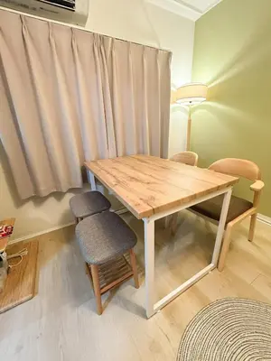 a wooden table and chairs in a room with a window at Family Friendly Japanese Style Room near Skytree in Tokyo