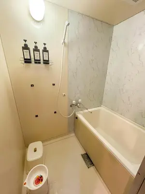 a bathroom with a tub and a toilet and a sink at Family Friendly Japanese Style Room near Skytree in Tokyo