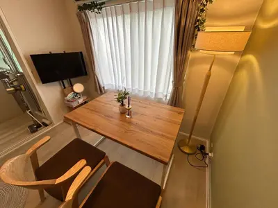 a small room with a wooden table and a lamp at Family Friendly Japanese Style Room near Skytree in Tokyo