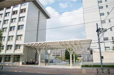 a large white building with a canopy in front of it at HANANOSATO\u677f\u6a4b\u4e2d\u4e38\u753aa in Tokyo
