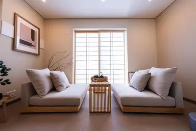 a living room with two couches in front of a window at Shinjuku 90sqm Private Villa with Sakura View Spacious & Quiet in Tokyo