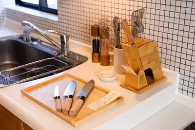a kitchen counter with knives on a cutting board at Shinjuku 90sqm Private Villa with Sakura View Spacious & Quiet in Tokyo