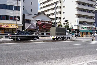 a truck parked on the side of a city street at Space Air Building 5F - Vacation STAY 11430 in Tokyo