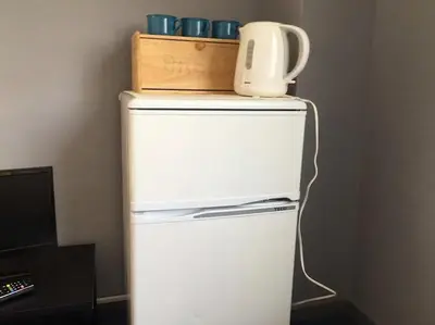 a white refrigerator with a jug on top of it at Space Air Building 5F - Vacation STAY 11432 in Tokyo