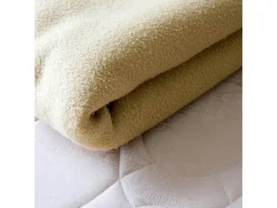 a roll of white towels sitting on top of a bed at Smile Hotel Tokyo Shinkoiwa - Vacation STAY 33631v in Tokyo