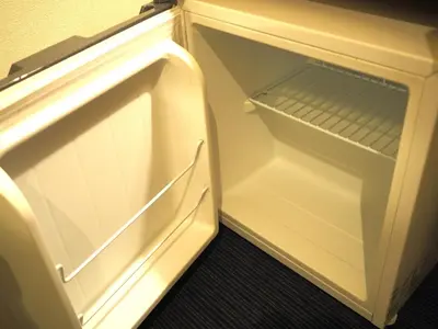 an empty refrigerator with its door open in a room at Smile Hotel Tokyo Shinkoiwa - Vacation STAY 33618v in Tokyo