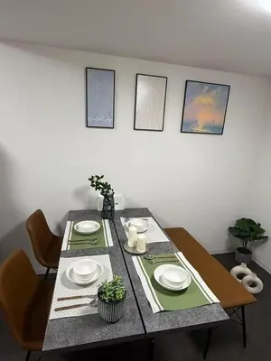a dining room table with two chairs and a table with plates at Taito-ku - House - Vacation STAY 20130 in Tokyo