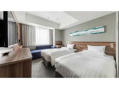 a hotel room with two beds and a couch at Far East Village Hotel Tokyo Ariake - Vacation STAY 31673v in Tokyo