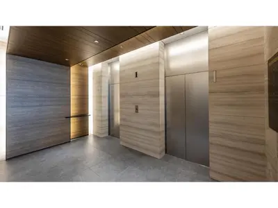 a hallway with wooden doors in a building at Far East Village Hotel Tokyo Ariake - Vacation STAY 31673v in Tokyo