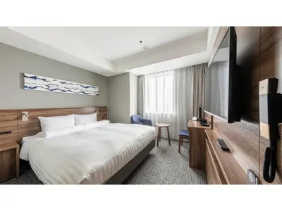 a hotel room with a bed and a flat screen tv at Far East Village Hotel Tokyo Ariake - Vacation STAY 31631v in Tokyo