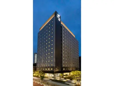 a tall building with a clock on top of it at Far East Village Hotel Tokyo Ariake - Vacation STAY 31643v in Tokyo
