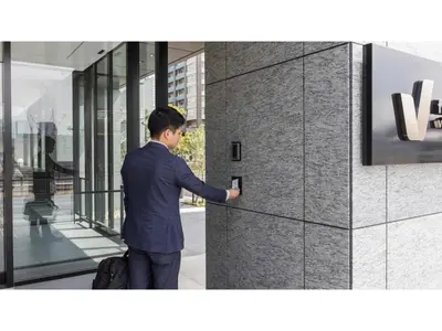 a man in a suit is pressing a button on a wall at Far East Village Hotel Tokyo Ariake - Vacation STAY 26441v in Tokyo