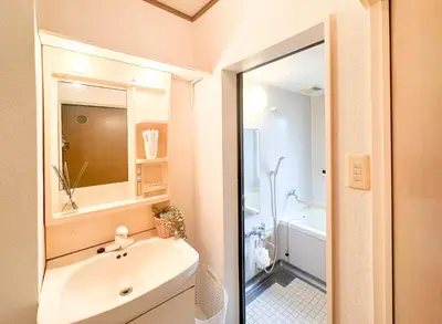 a bathroom with a sink and a toilet and a tub at Katsushika-ku - House - Vacation STAY 20111 in Tokyo