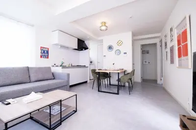 a living room with a couch and a table at Belshaart Kamikitazawa - Vacation STAY 20138 in Tokyo