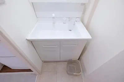 a bathroom with a white sink in a room at Belshaart Kamikitazawa - Vacation STAY 20138 in Tokyo