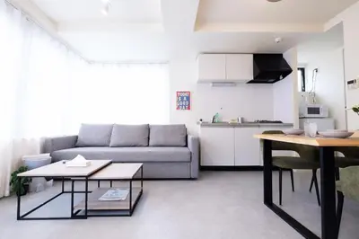 a living room with a couch and a table at Belshaart Kamikitazawa - Vacation STAY 20138 in Tokyo