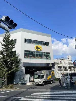 a truck is parked in front of a building at Okubo Gury Sanny in Tokyo