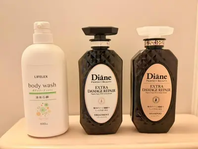three bottles of laundry detergents sitting on a shelf at Ikebukuro Sugamo\u99c5\u8fd1B4 in Tokyo