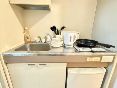 a kitchen counter with a sink and a frying pan at Ikebukuro Sugamo\u99c5\u8fd1B4 in Tokyo