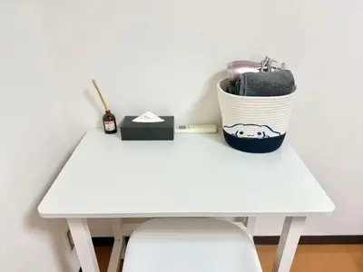a white table with a basket on top of it at Ikebukuro Sugamo\u99c5\u8fd1B4 in Tokyo