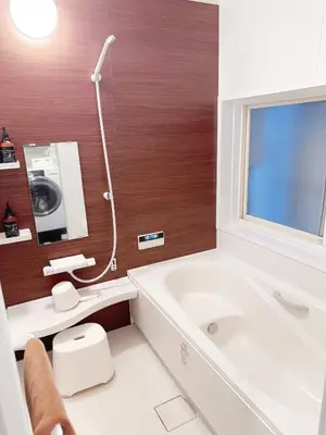 a bathroom with a tub and a toilet and a sink at 4 min to JR Entire 3BR House w Garage Family Friendly Fast WiFi in Tokyo