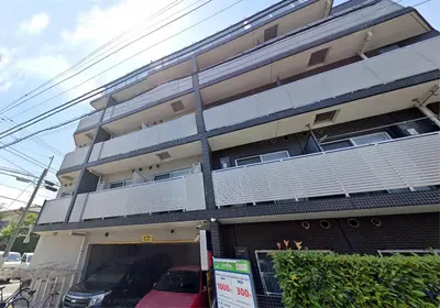 a building with a car parked in front of it at SYFORME KEIKYU-KAMATA Room210 in Tokyo