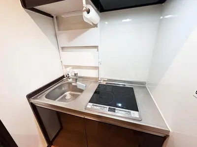 a small kitchen with a sink and a counter top at Private rental house Yado Torigoe in Tokyo