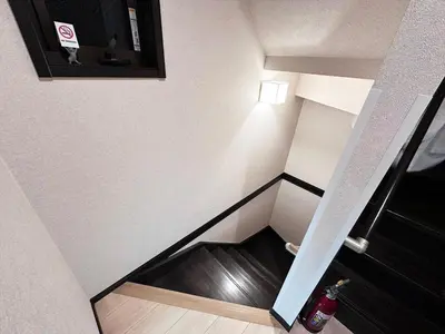an empty stairwell in a room with a fire hydrant at Private rental house Yado Torigoe in Tokyo