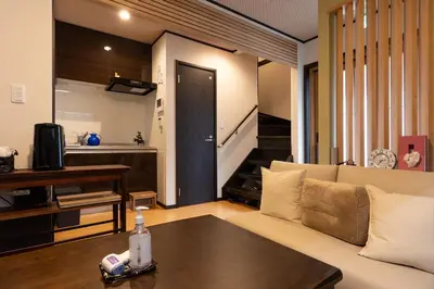 a living room with a couch and a table at Private rental house Yado Torigoe in Tokyo