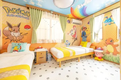 a childrens bedroom with two beds and a cartoon mural at Live the Anime Dream! Unique Themed Guest House for Families & Groups in Tokyo in Tokyo