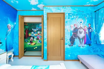 a bedroom with arozen wall mural in a room at Live the Anime Dream! Unique Themed Guest House for Families & Groups in Tokyo in Tokyo