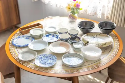 a table with blue and white dishes on it at Live the Anime Dream! Unique Themed Guest House for Families & Groups in Tokyo in Tokyo