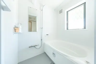 a white bathroom with a window and a sink at Live the Anime Dream! Unique Themed Guest House for Families & Groups in Tokyo in Tokyo