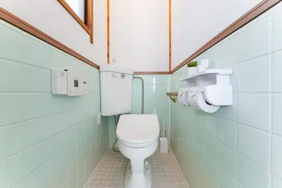 a bathroom with a white toilet in a room at Kasai Hotel near Shinjuku, Akihabara, Asakusa TDR-Disney T-LAB \u4e00\u68df\u307e\u308b\u307e\u308b\u845b\u897f\u30db\u30c6\u30eb\u6700\u59279\u540d in Tokyo
