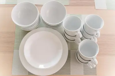 a group of white cups and plates on a table at Kasai Hotel near Shinjuku, Akihabara, Asakusa TDR-Disney T-LAB \u4e00\u68df\u307e\u308b\u307e\u308b\u845b\u897f\u30db\u30c6\u30eb\u6700\u59279\u540d in Tokyo