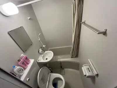 a small bathroom with a toilet and a sink at Sweet house 5 minutes walk from Shibuya station Dogenzaka apartment in Tokyo