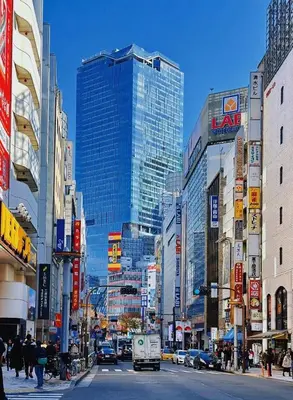 a busy city street with many tall buildings at Sweet house 5 minutes walk from Shibuya station Dogenzaka apartment in Tokyo