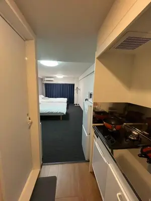 a room with a kitchen and a bedroom with a bed at Sweet house 5 minutes walk from Shibuya station Dogenzaka apartment in Tokyo