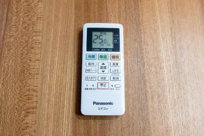 a remote control sitting on top of a wooden table at Matsubara Station 2 minutes Shinjuku, Shibuya 15 minutes Pure Japanese style house where you can feel the seasons Maximum 6 people rent a house Quiet house in Tokyo