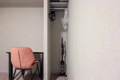 a chair sitting in front of a door at CLASS Shinagawa in Tokyo