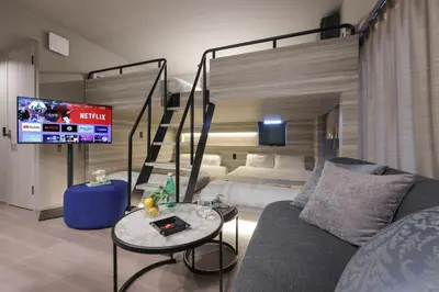 a living room with a couch and a bunk bed at CLASS Shinagawa in Tokyo