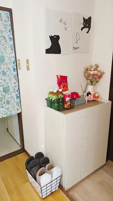 a corner of a room with a table with a shelf with food at SkyTree-401 in Tokyo