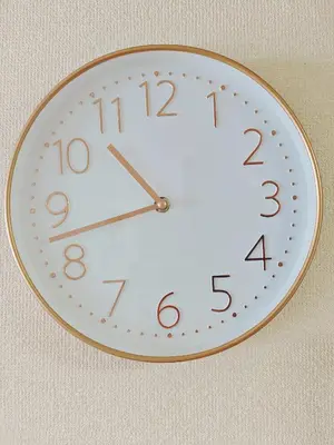 a clock is hanging on a wall at SkyTree-401 in Tokyo